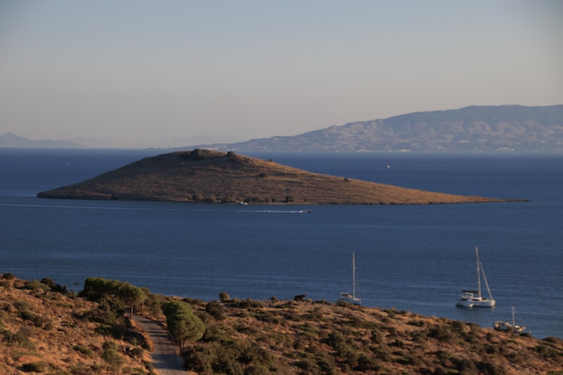 A small island in the middle of a large body of water
